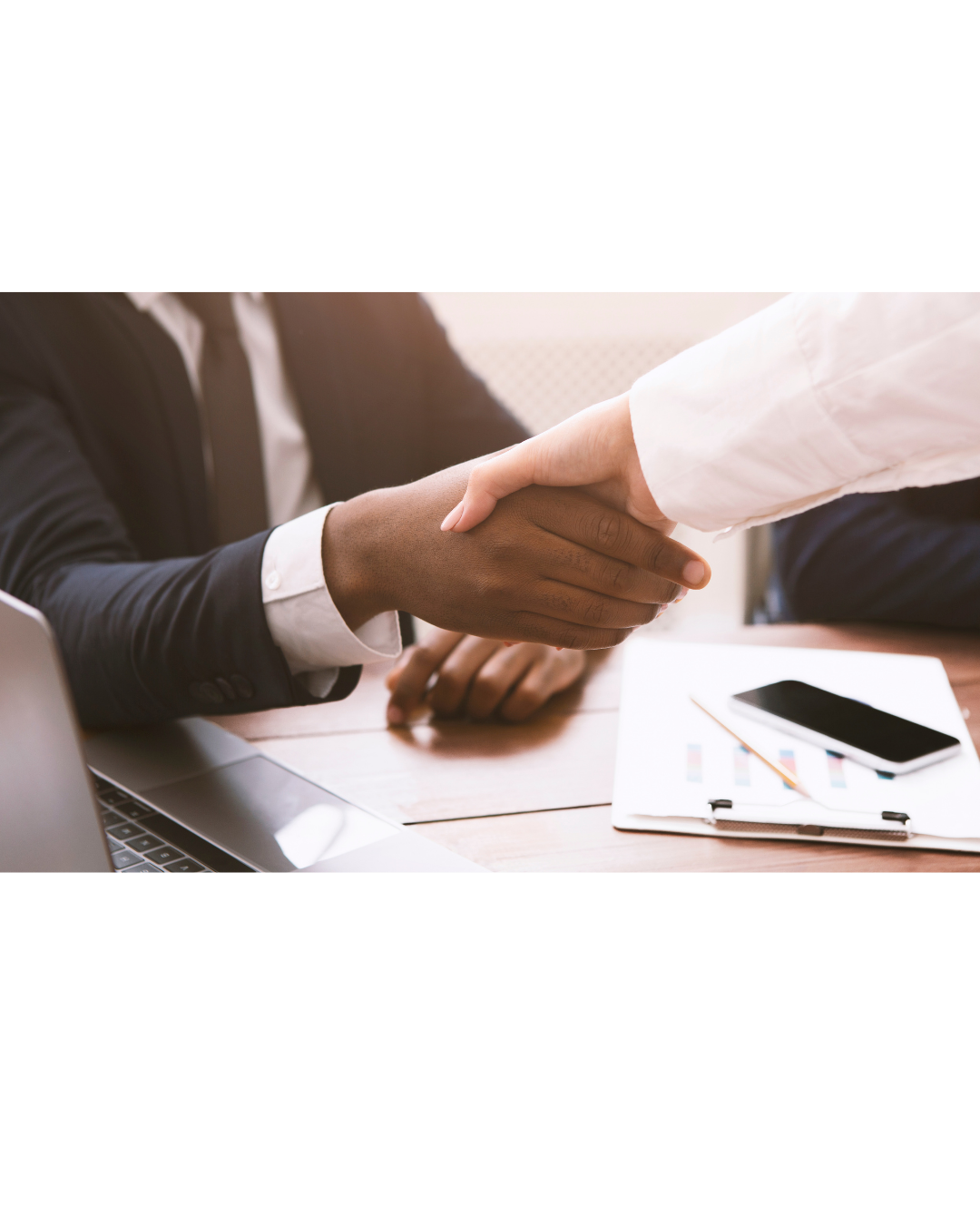 Mortgage broker and client reviewing loan documents